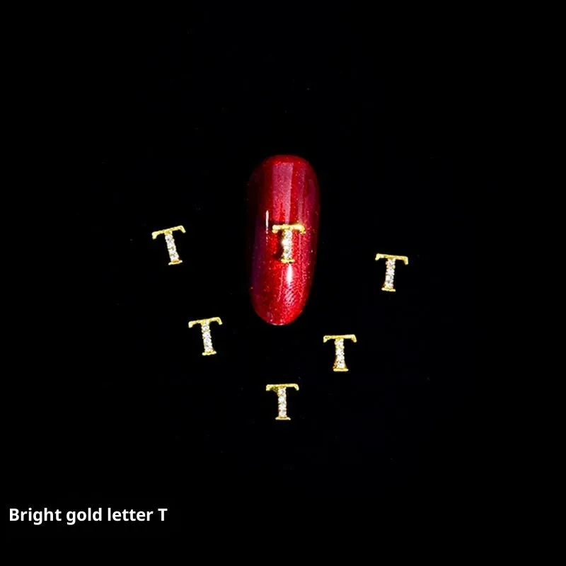 Gold alloy letter A nail ornament charm with crystal detail on a square chain base
