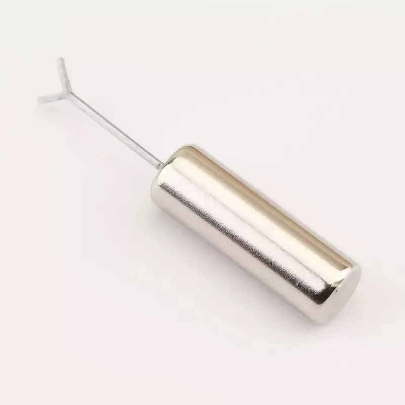 Cylindrical metal nail art magnet and Y-shaped bracket for cat eye gel polish designs.