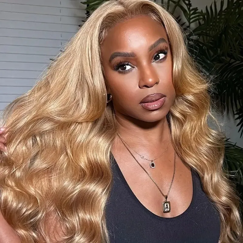 Light brown long synthetic curly wig with big waves and side bangs shown at medium length