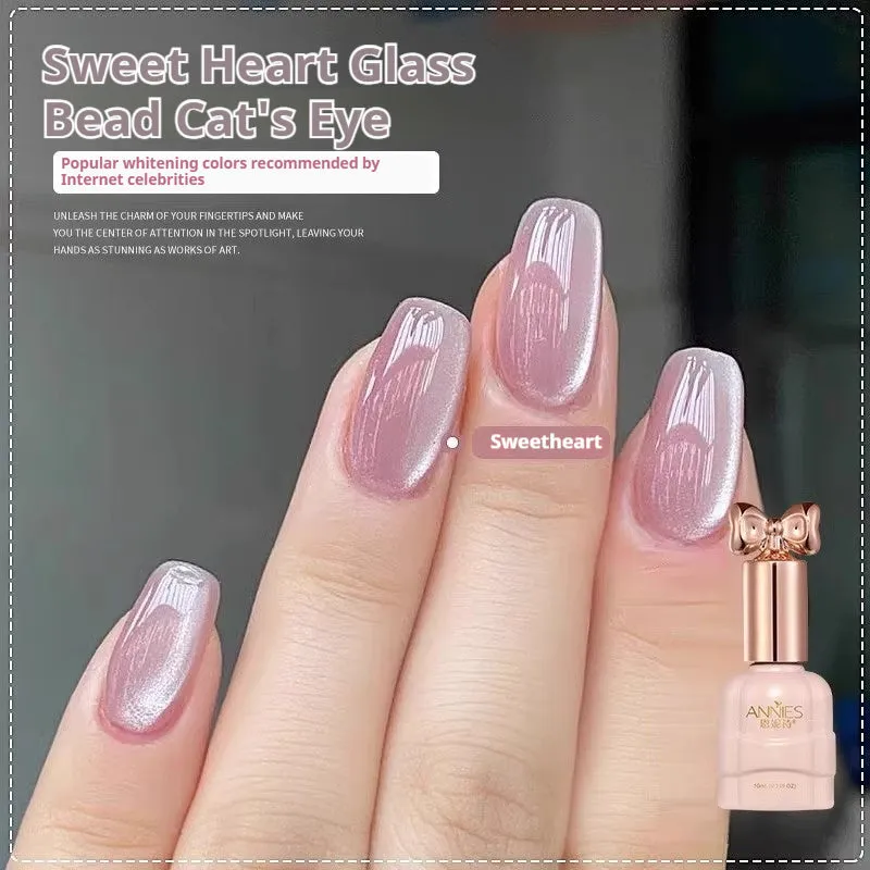 Bottle of micro glass bead cat's eye gel nail polish showing a cat's eye effect swatch.