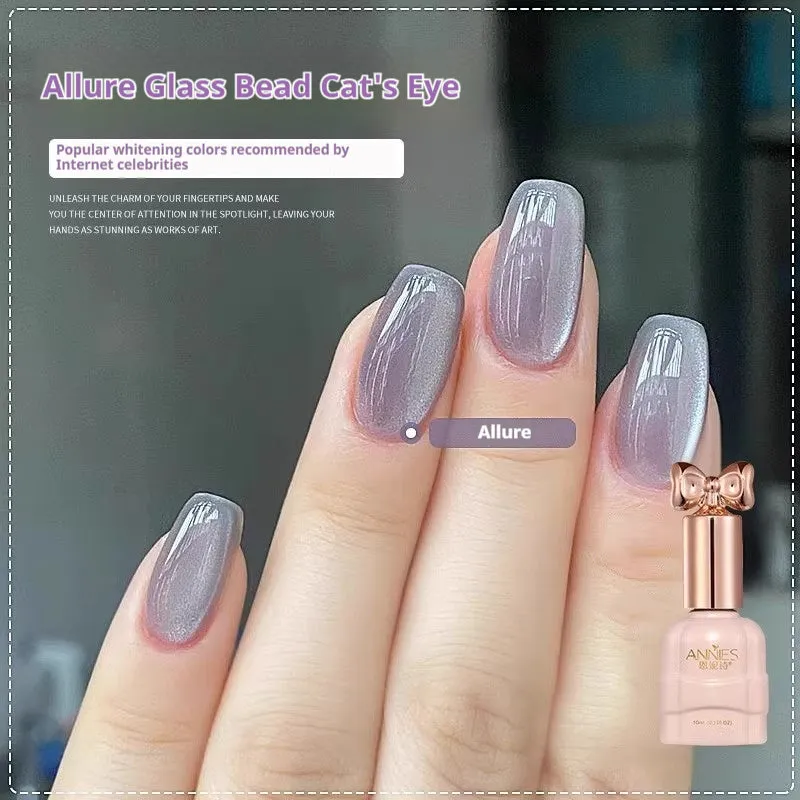 Bottle of micro glass bead cat's eye gel nail polish showing a cat's eye effect swatch.