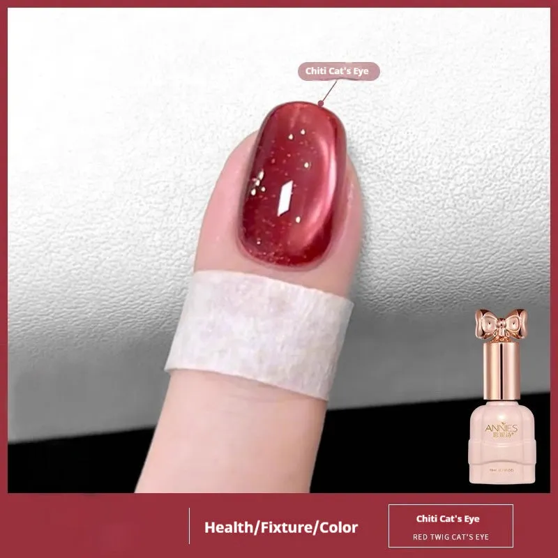 Bottle of micro glass bead cat's eye gel nail polish showing a cat's eye effect swatch.