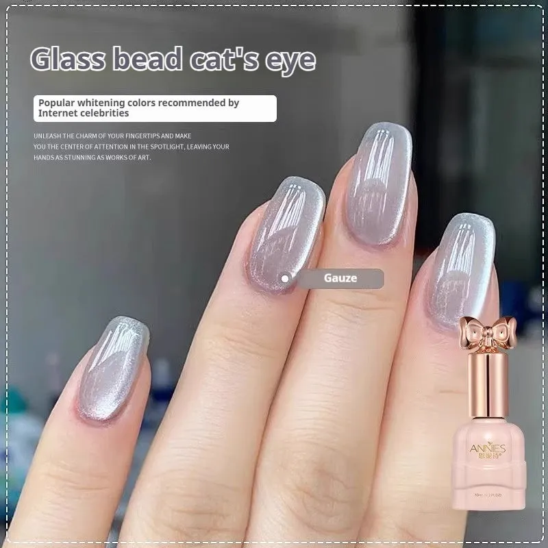 Bottle of micro glass bead cat's eye gel nail polish showing a cat's eye effect swatch.