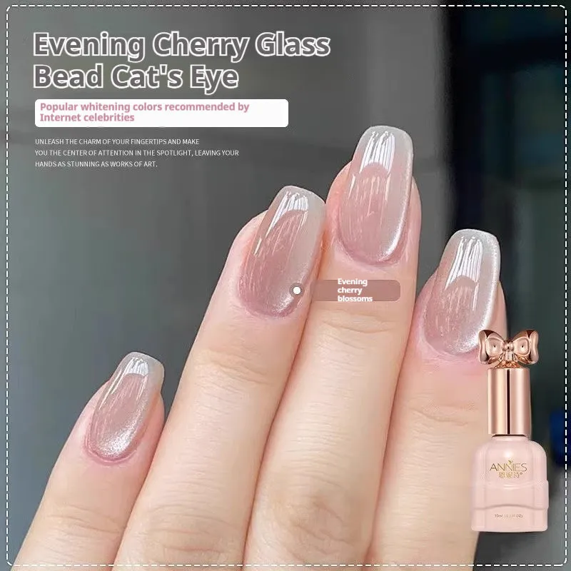 Bottle of micro glass bead cat's eye gel nail polish showing a cat's eye effect swatch.