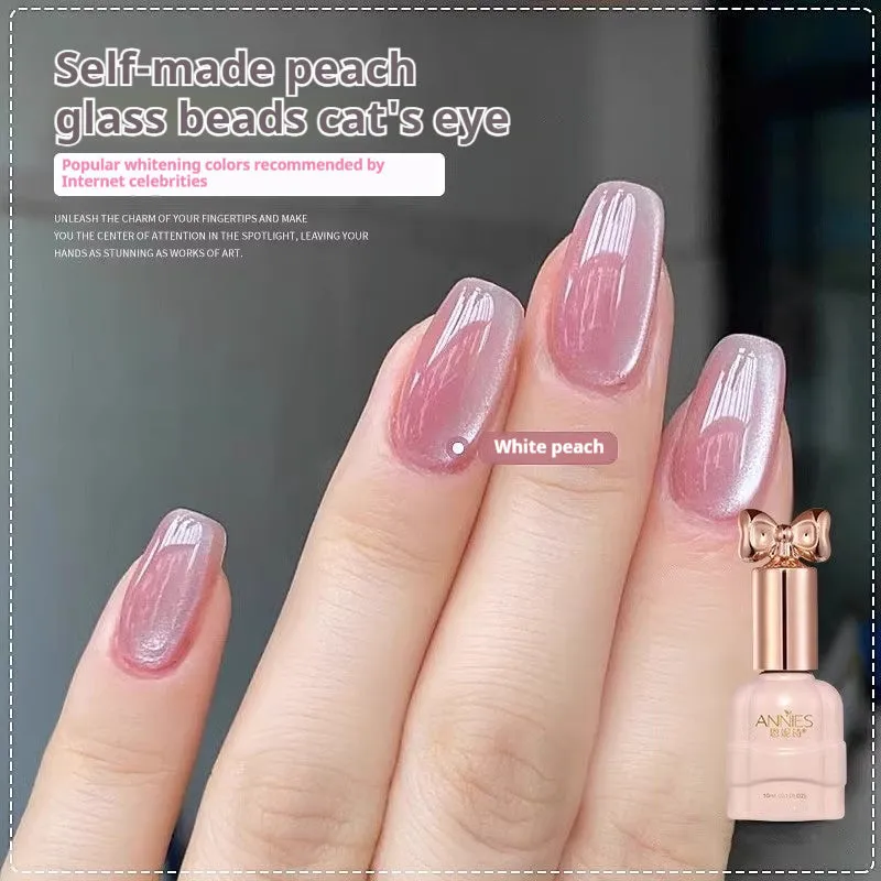 Bottle of micro glass bead cat's eye gel nail polish showing a cat's eye effect swatch.