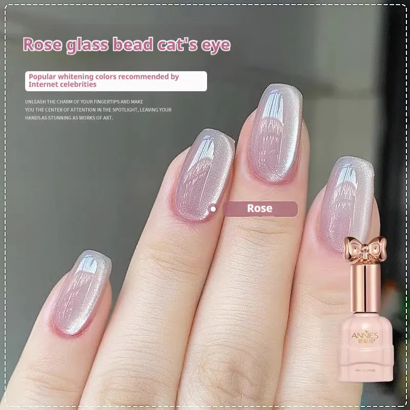 Bottle of micro glass bead cat's eye gel nail polish showing a cat's eye effect swatch.