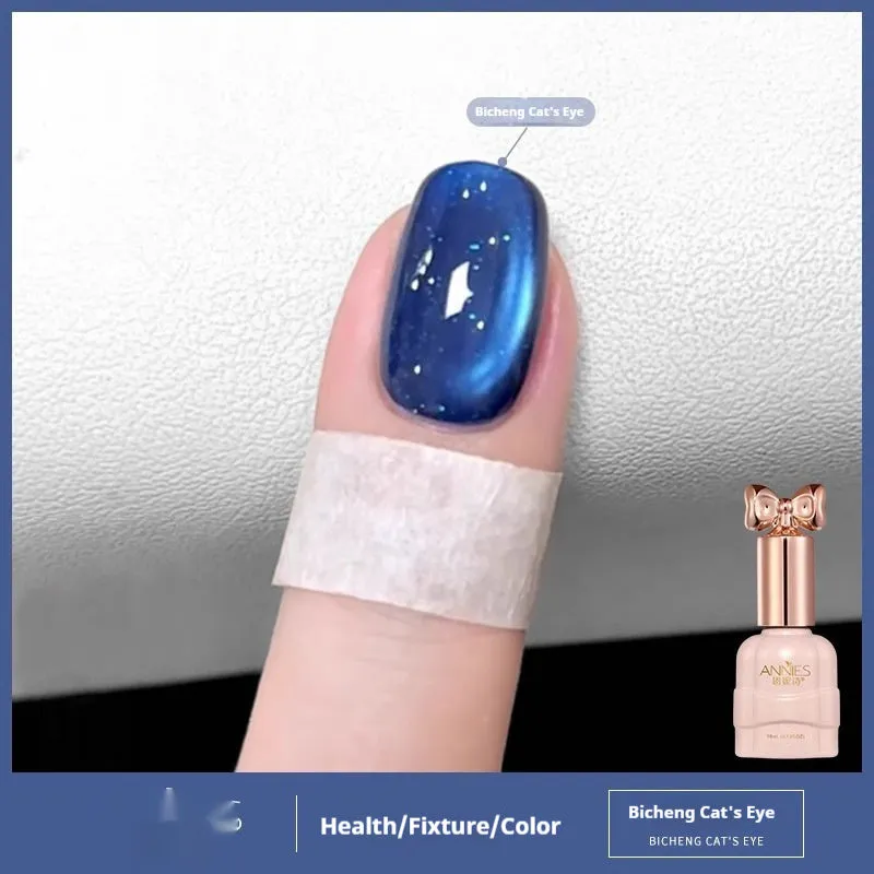 Bottle of micro glass bead cat's eye gel nail polish showing a cat's eye effect swatch.