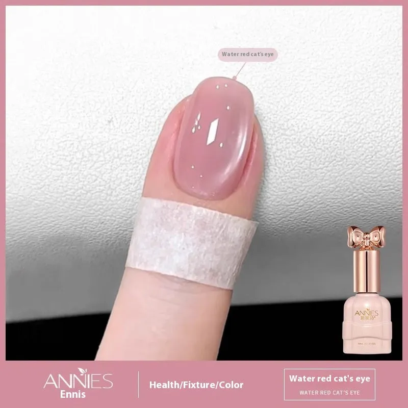 Bottle of micro glass bead cat's eye gel nail polish showing a cat's eye effect swatch.