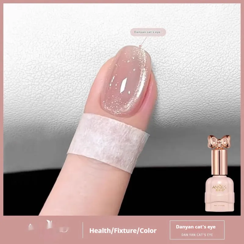 Bottle of micro glass bead cat's eye gel nail polish showing a cat's eye effect swatch.