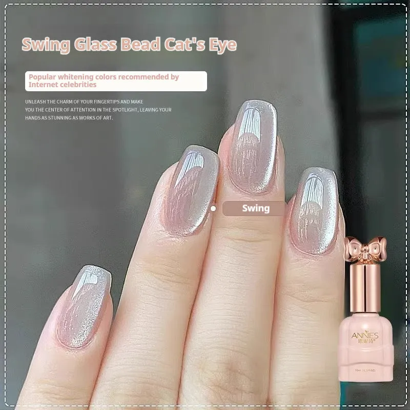 Bottle of micro glass bead cat's eye gel nail polish showing a cat's eye effect swatch.