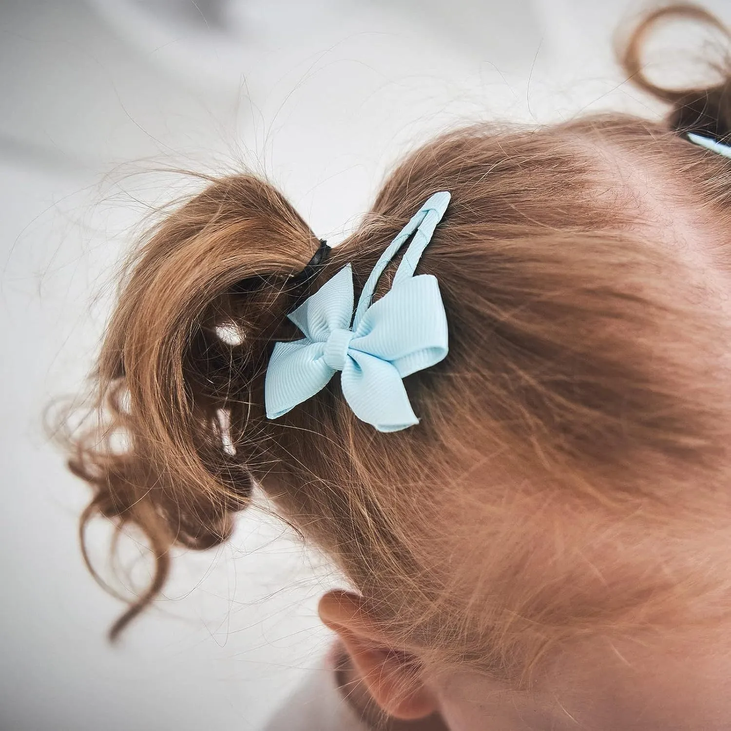 40 colourful grosgrain ribbon baby hair bows with soft wrapped snap clips.