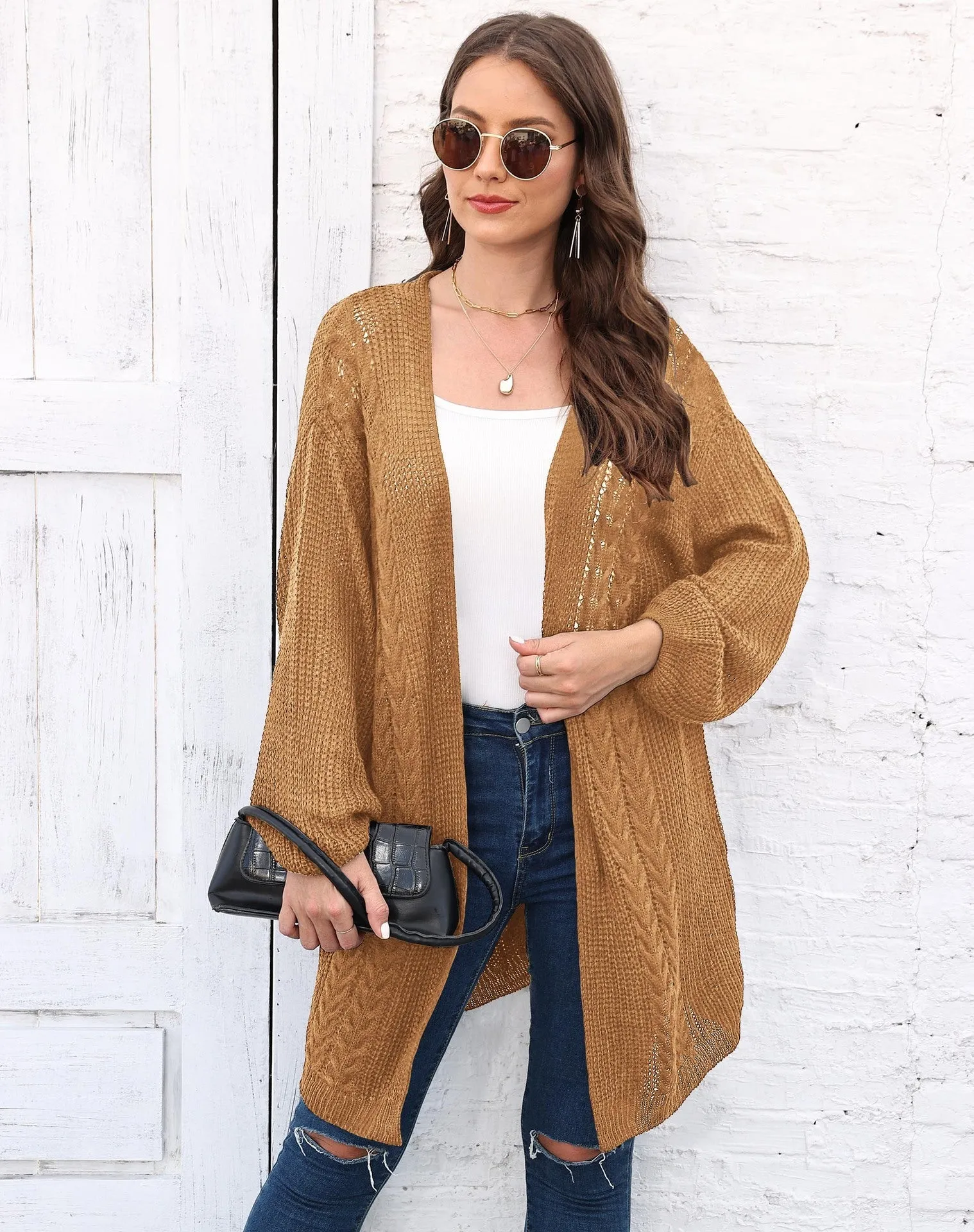 Women's loose acrylic sweater coat in a solid colour, shown in a casual style.
