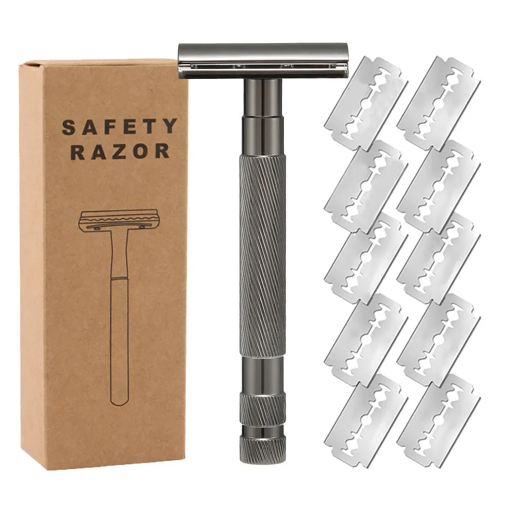 Old style manual double-sided alloy safety razor with replacement blades and cleaning brush on a table.