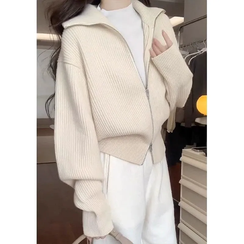 Grey Hong Kong style double zipper knitted cardigan with floral pattern on a hanger.