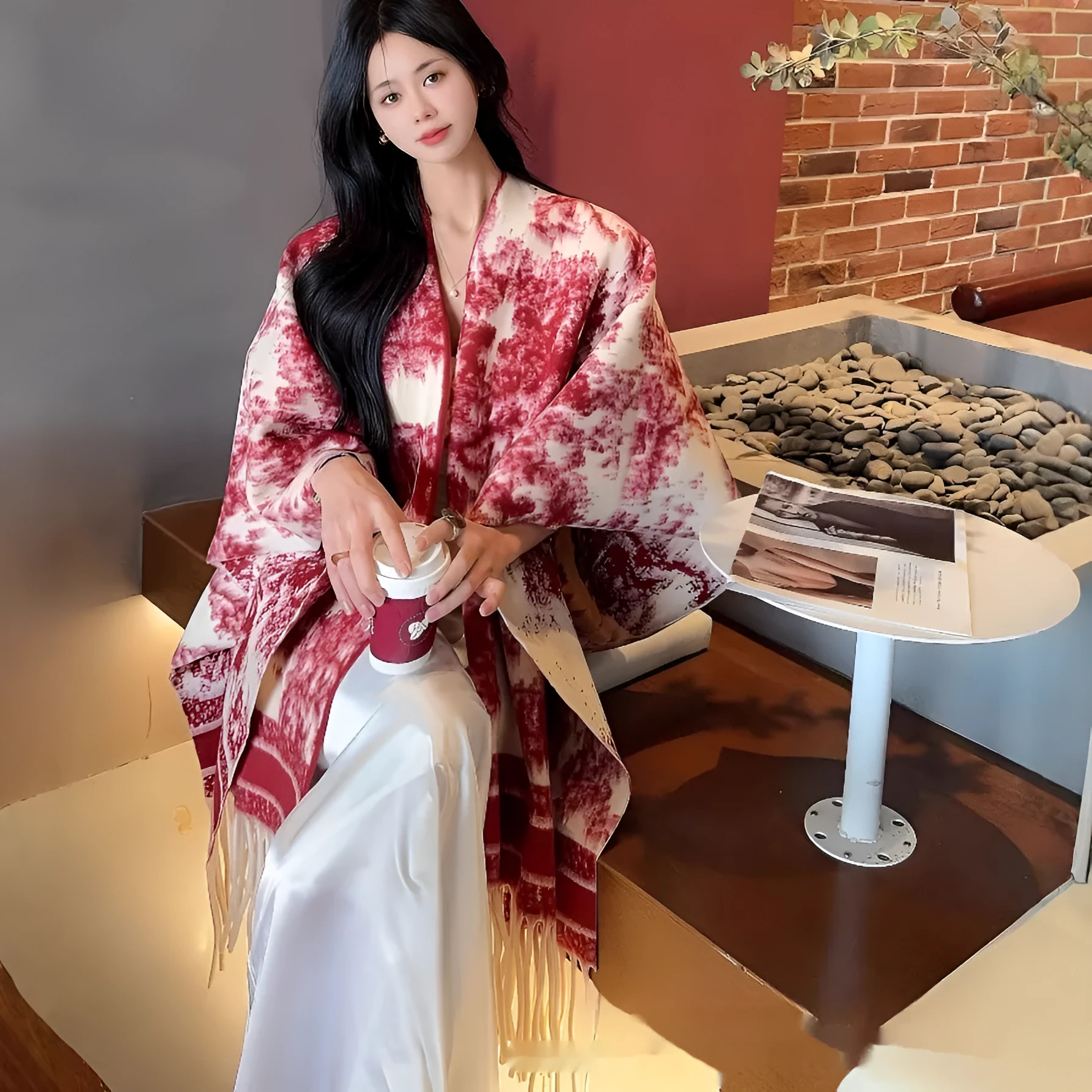 Women's tassel-trimmed polyester scarf cape worn as a shawl, shown in one of five available colours.