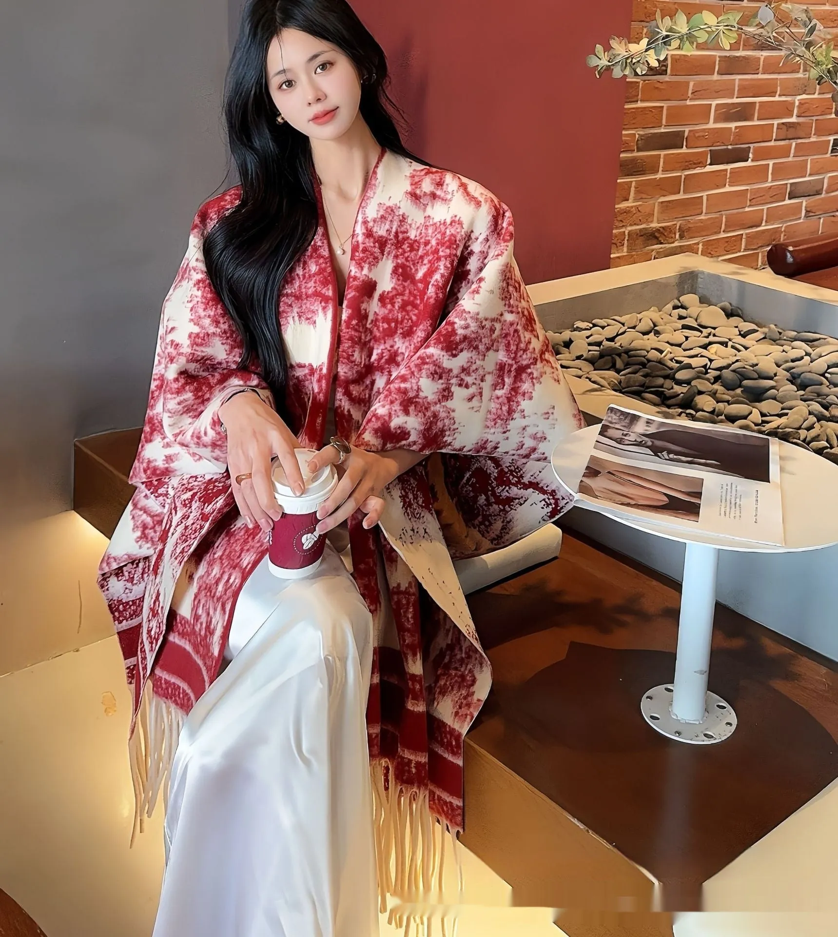 Women's tassel-trimmed polyester scarf cape worn as a shawl, shown in one of five available colours.