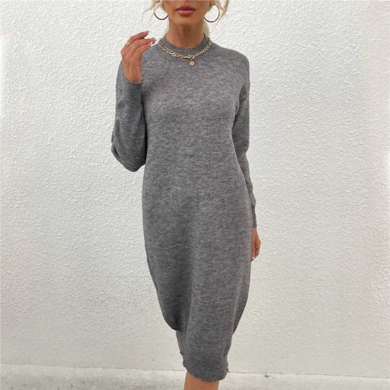 Grey women's crew neck long sleeve acrylic pullover sweater on a hanger.