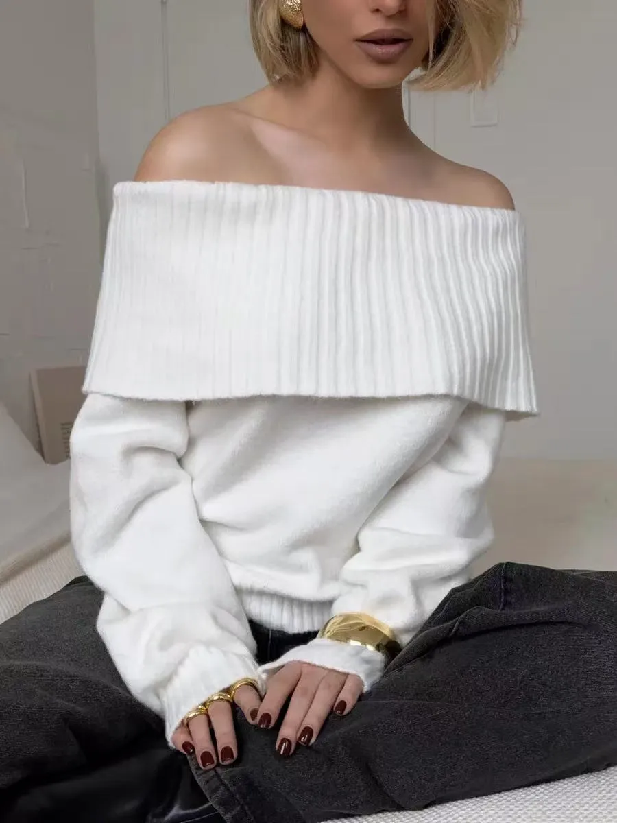 Woman wearing a grey off-the-shoulder sweater with a raised 3D texture pattern.