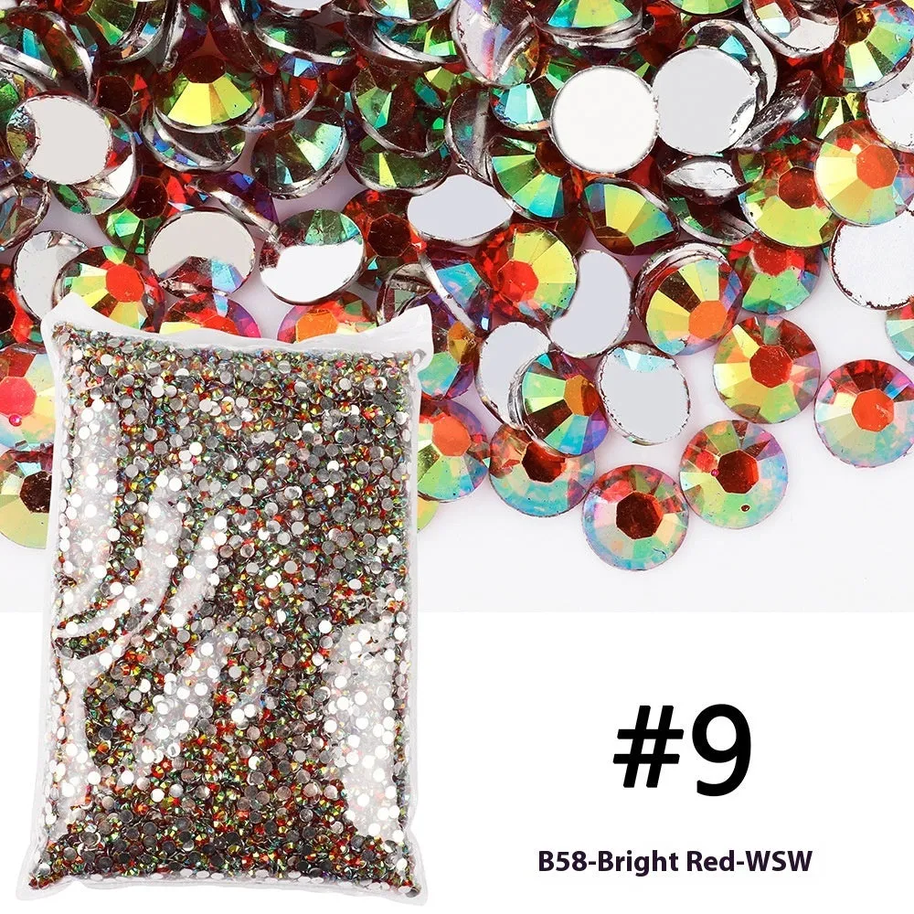 Assortment of multicoloured flat back resin rhinestones in various sizes for nail art and craft projects.