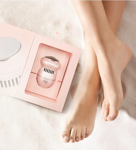 Beige and white electric foot file grinder with USB cable and two diamond grinding heads on a plain background