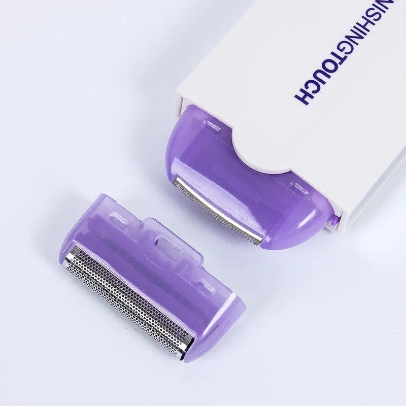 White electric hair removal shaver with foil head and trimmer head attachment on a blue background.