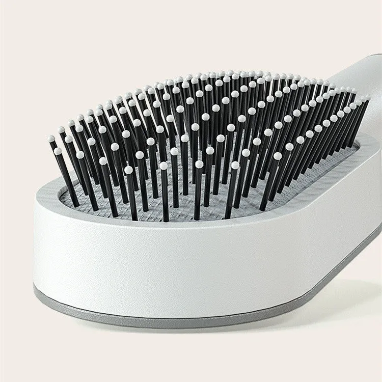 Self-cleaning hair brush with air cushion design in black gold, white, or black purple colours
