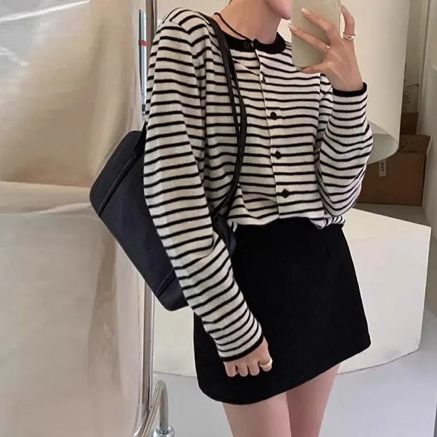 Dark gray and white striped women's cardigan coat with long sleeves and a slim fit.
