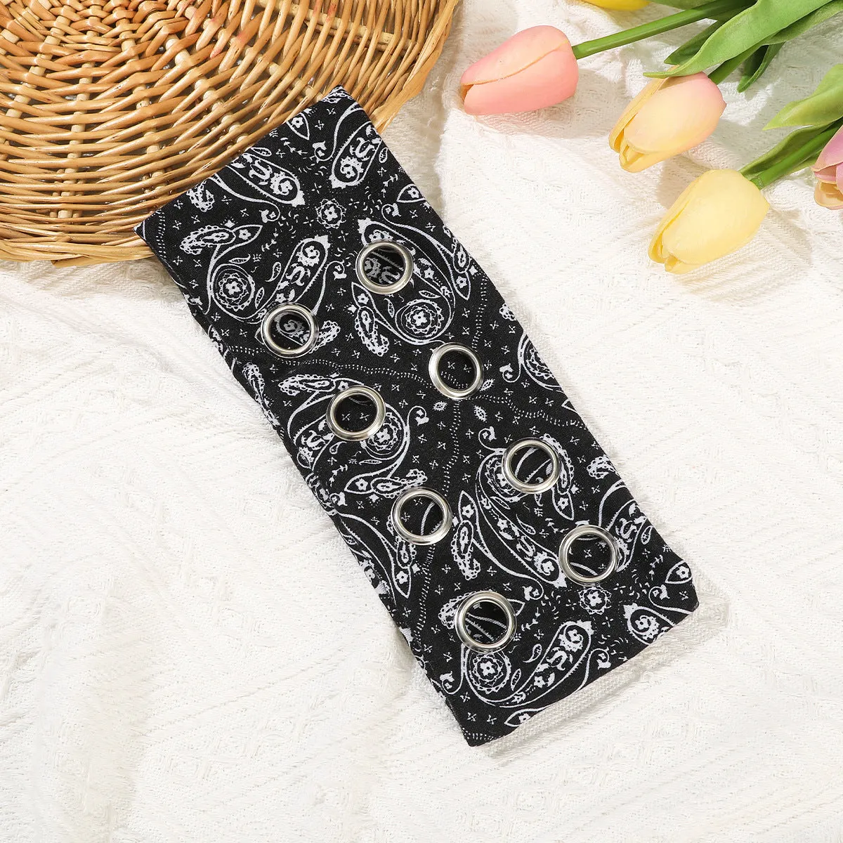 Black polyester hair band with integrated hollow metal circle in punk style.