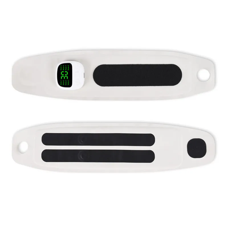 Adjustable hand massage instrument with coloured wristbands on a table
