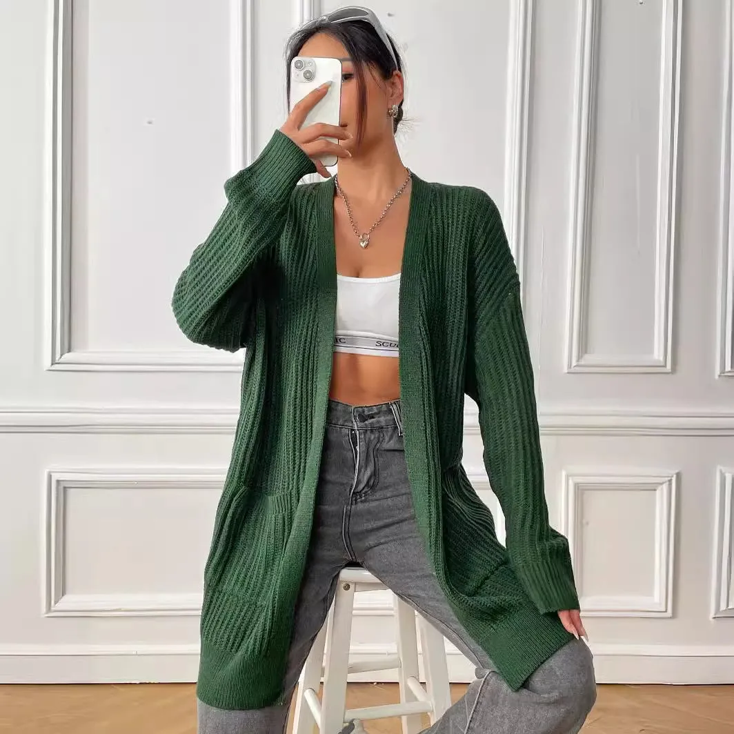 Women's loose fit acrylic cardigan with double pockets in dark green colour showing mid-length design