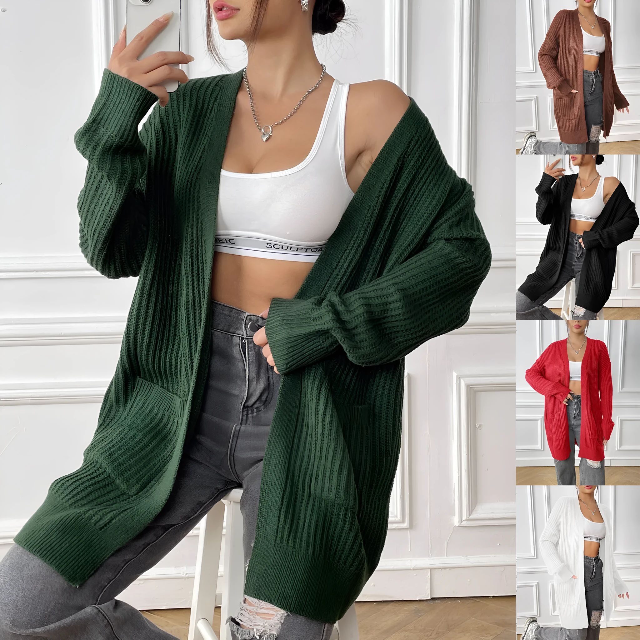 Women's loose fit acrylic cardigan with double pockets in dark green colour showing mid-length design