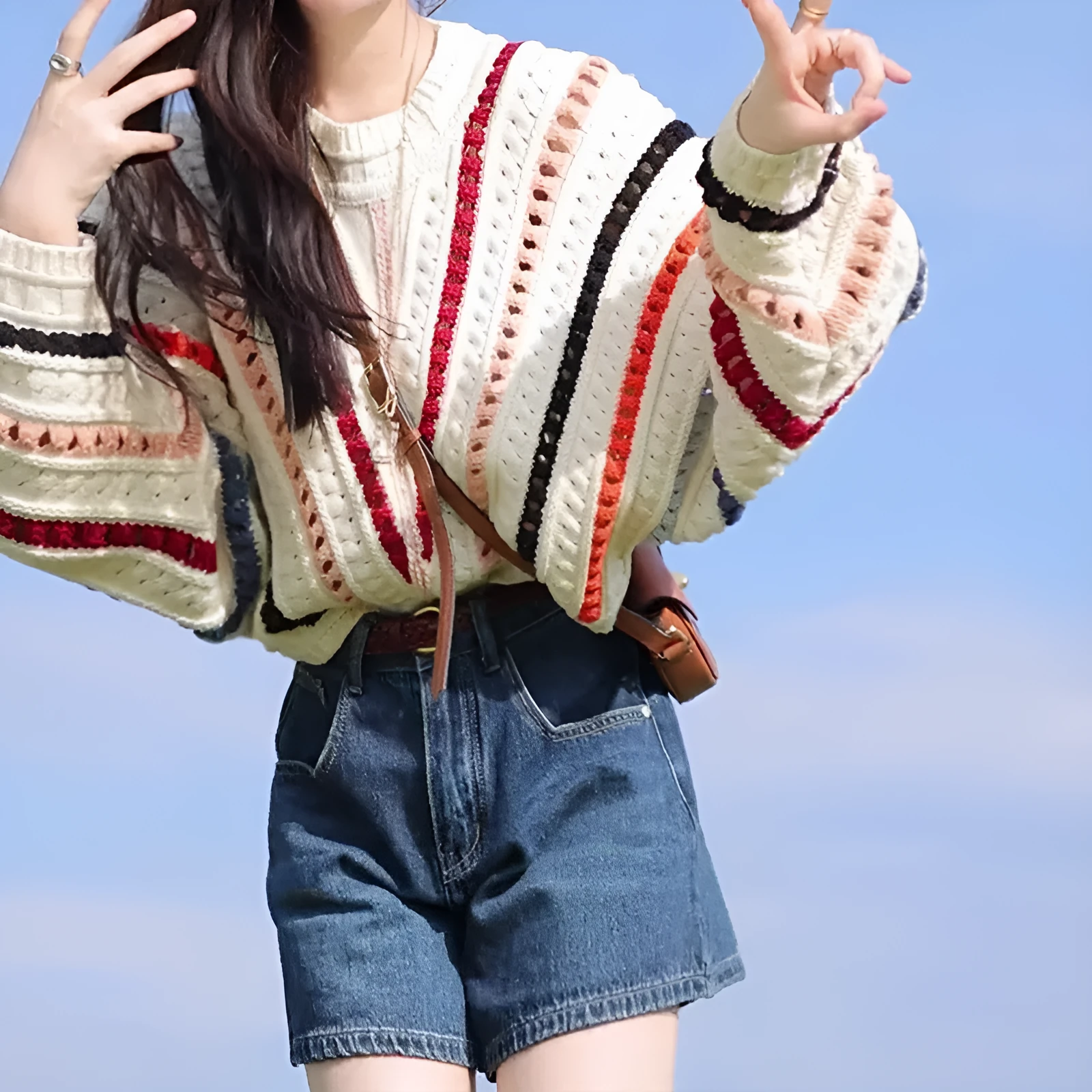 Women's rainbow striped loose sweater with batwing sleeves and hollow knit pattern