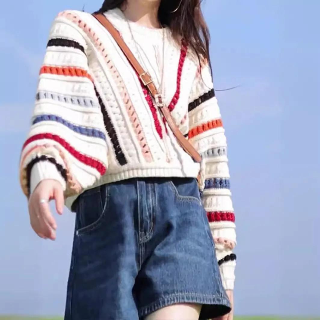 Women's rainbow striped loose sweater with batwing sleeves and hollow knit pattern