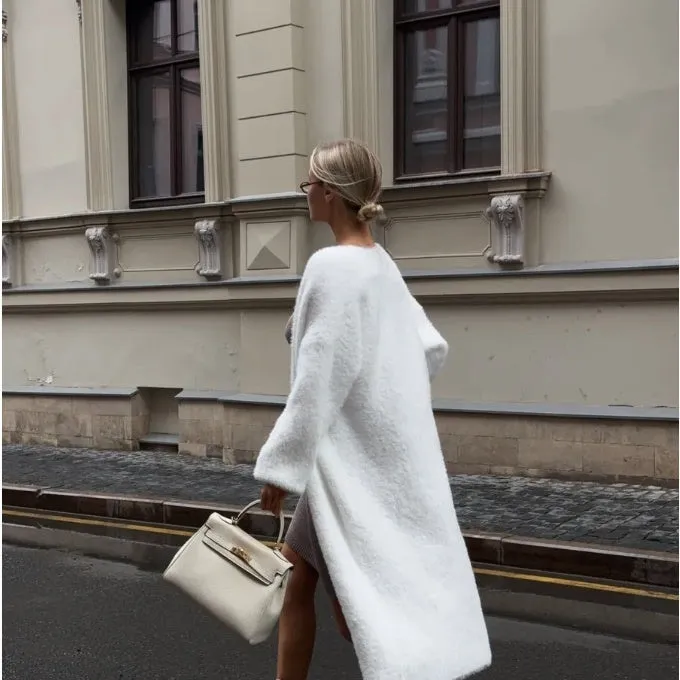 Long white women's cardigan jacket with thick knit and open front.