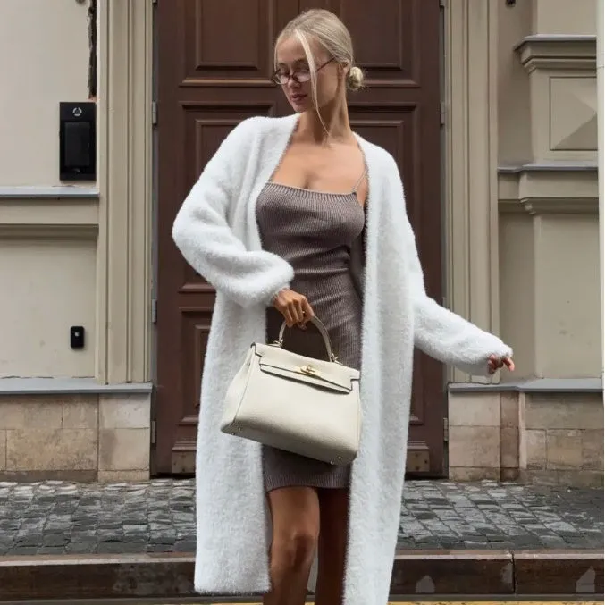 Long white women's cardigan jacket with thick knit and open front.