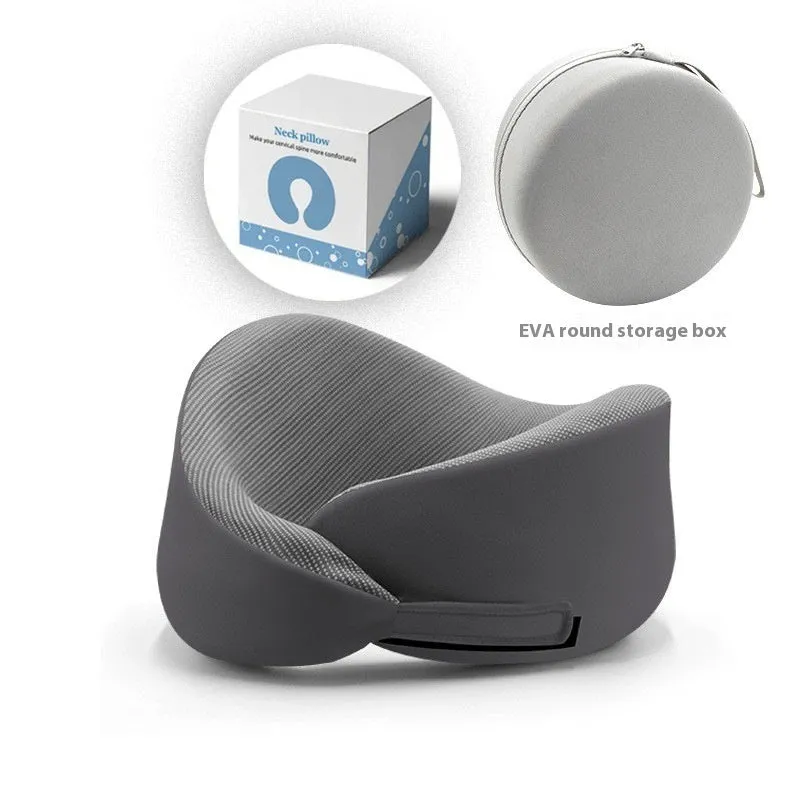 Light grey U-shaped memory foam neck pillow on a white background.