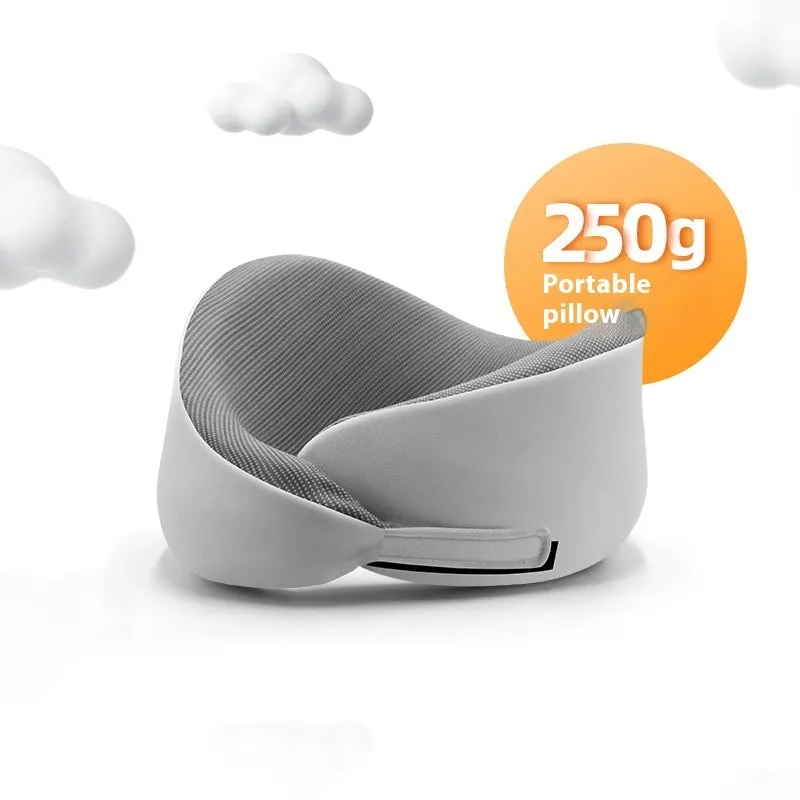 Light grey U-shaped memory foam neck pillow on a white background.