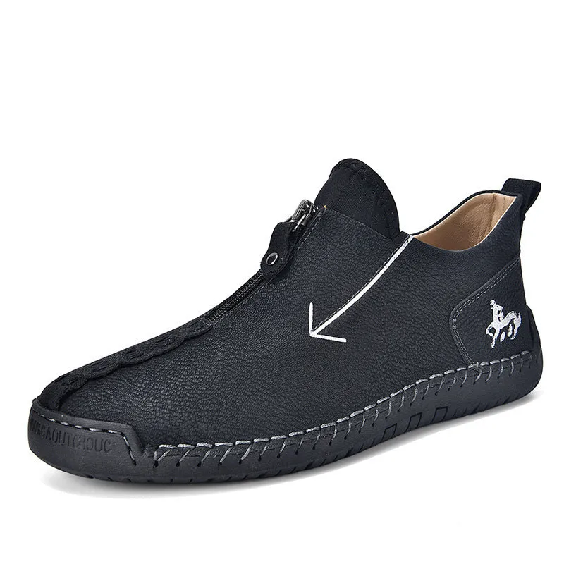 Men's black leather martin boots with a front metal zipper and round toe on a rubber sole.