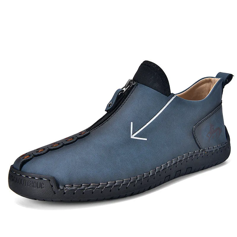 Men's black leather martin boots with a front metal zipper and round toe on a rubber sole.