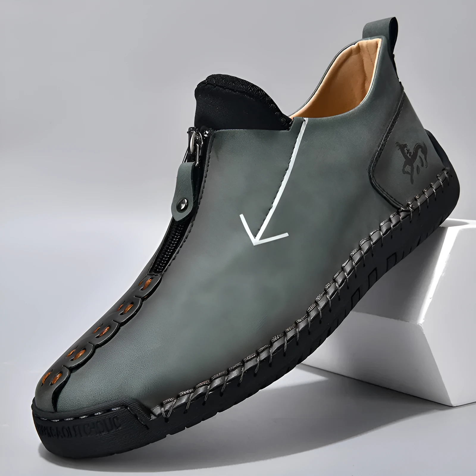 Men's black leather martin boots with a front metal zipper and round toe on a rubber sole.