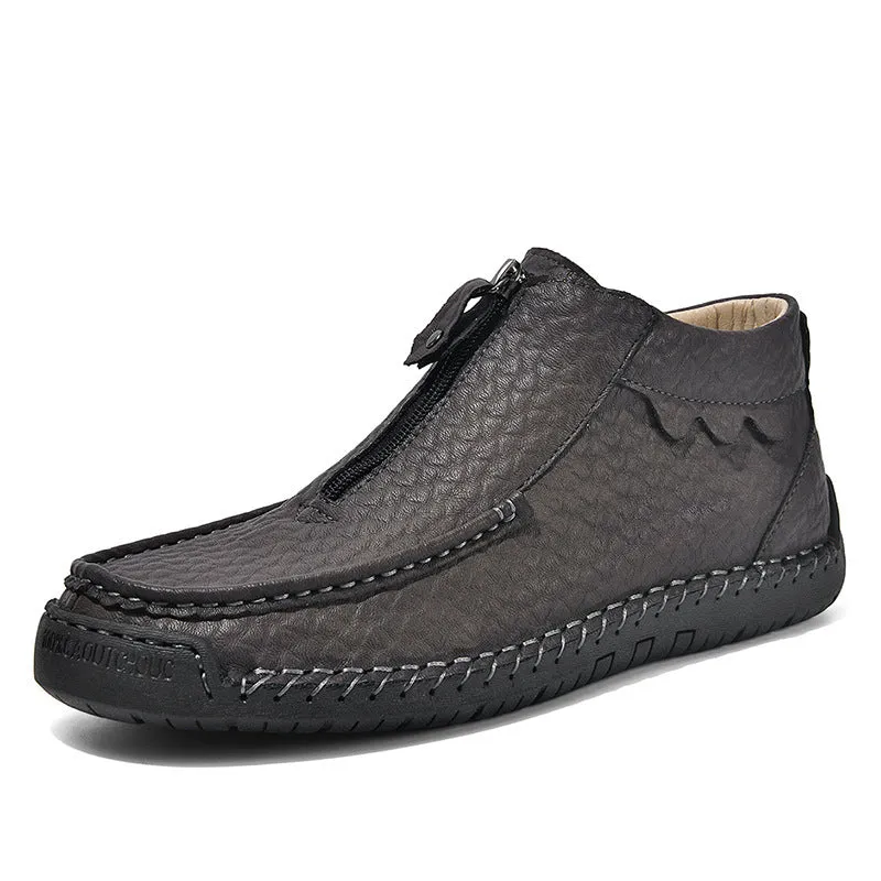 Men's black slip-on loafers with round toe and stitched sole on a plain background
