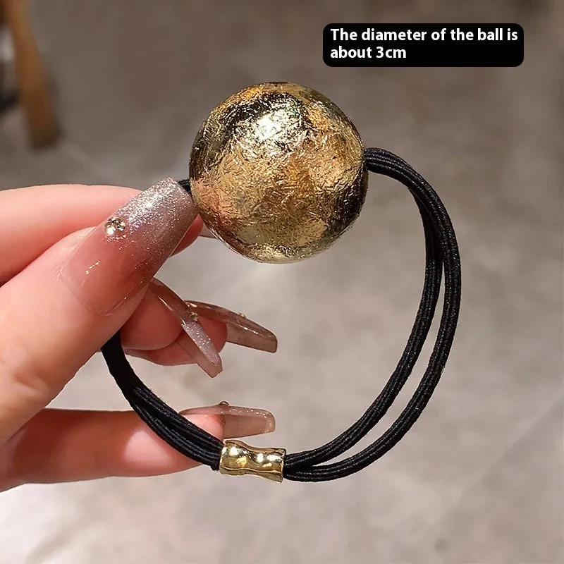 Resin hair band headdress with electroplated gold finish, round head rope style on a white background