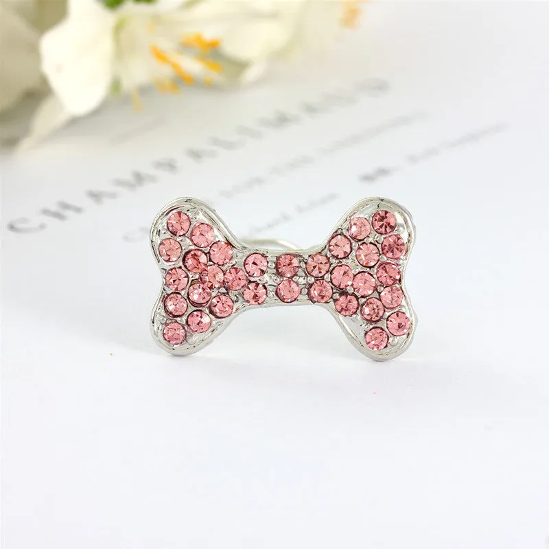 Rhinestone dog bone hair clip in alloy, white colour, on a neutral background