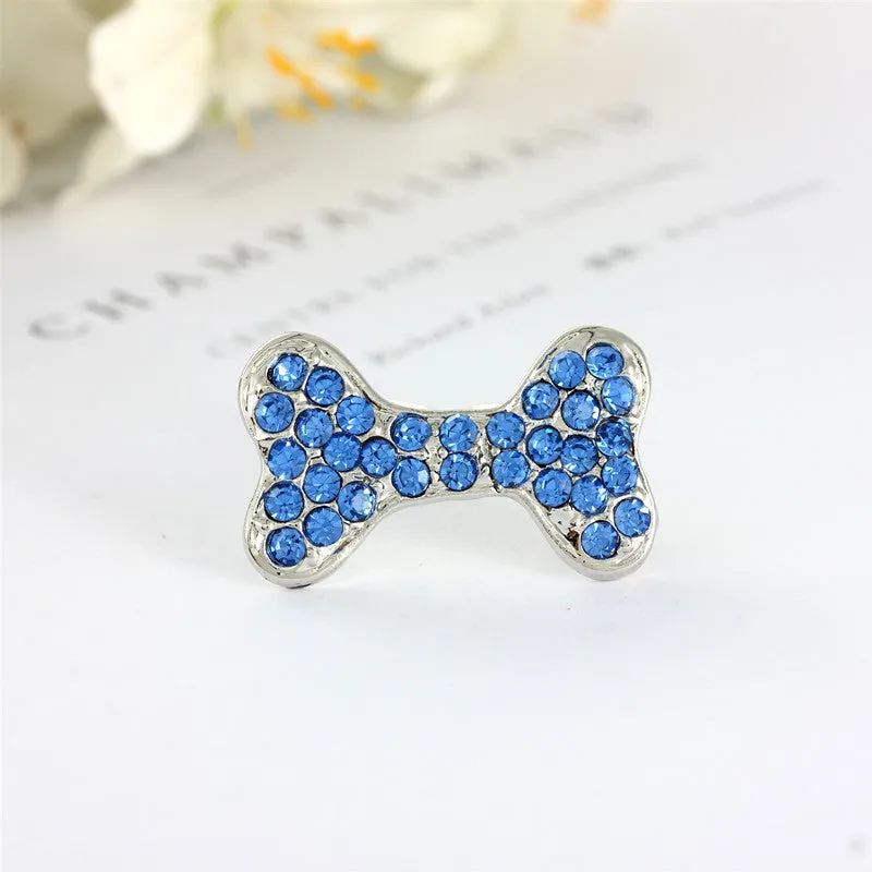Rhinestone dog bone hair clip in alloy, white colour, on a neutral background
