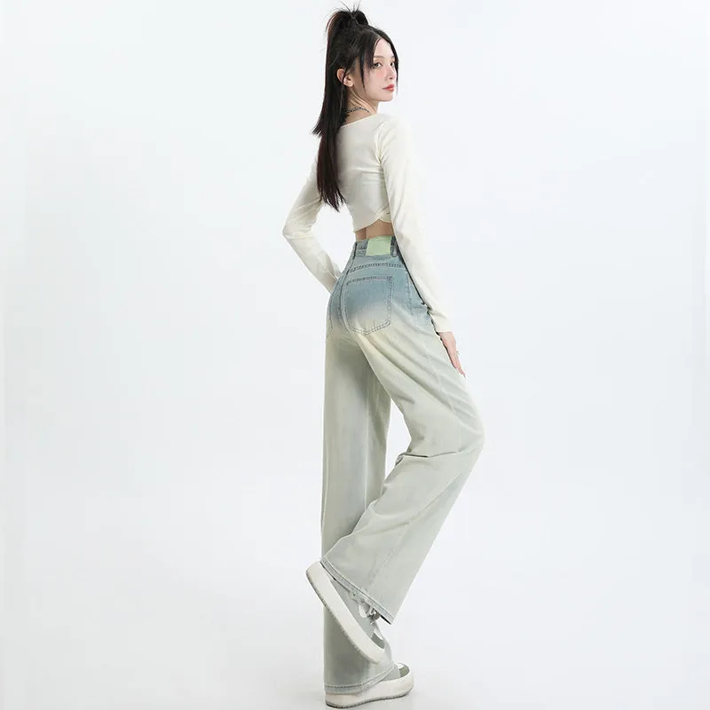 Women's gradient blue wide leg straight-leg denim trousers laid flat.