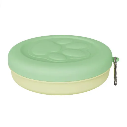 Collapsible two-layer silicone dog travel bowl in light pink and green, showing food and water compartments.