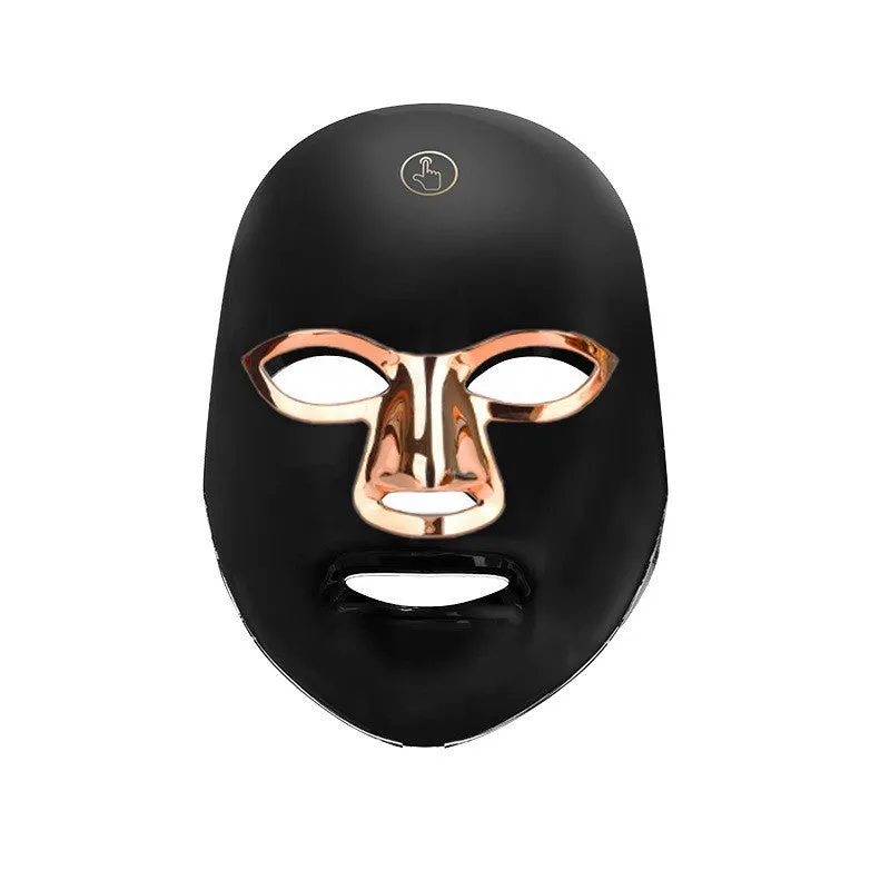 Rechargeable LED beauty mask with touch controls in white and black colour options on a table.