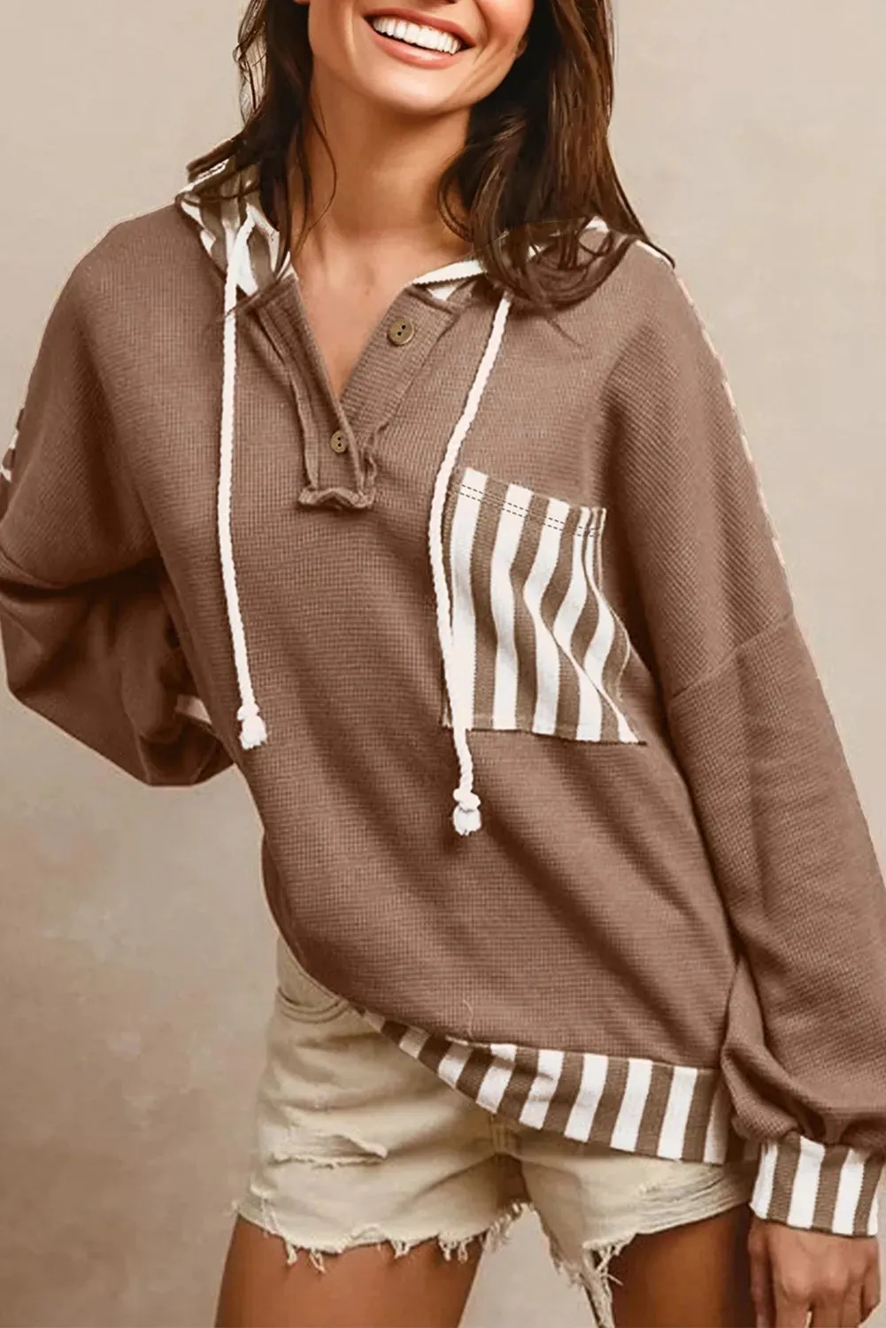 Straw yellow hoodie with waffle texture striped patchwork and a button neck drawstring