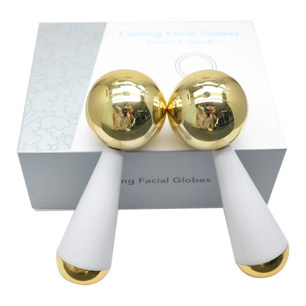Silver stainless steel facial ice roller measuring 145x50mm on a clean surface
