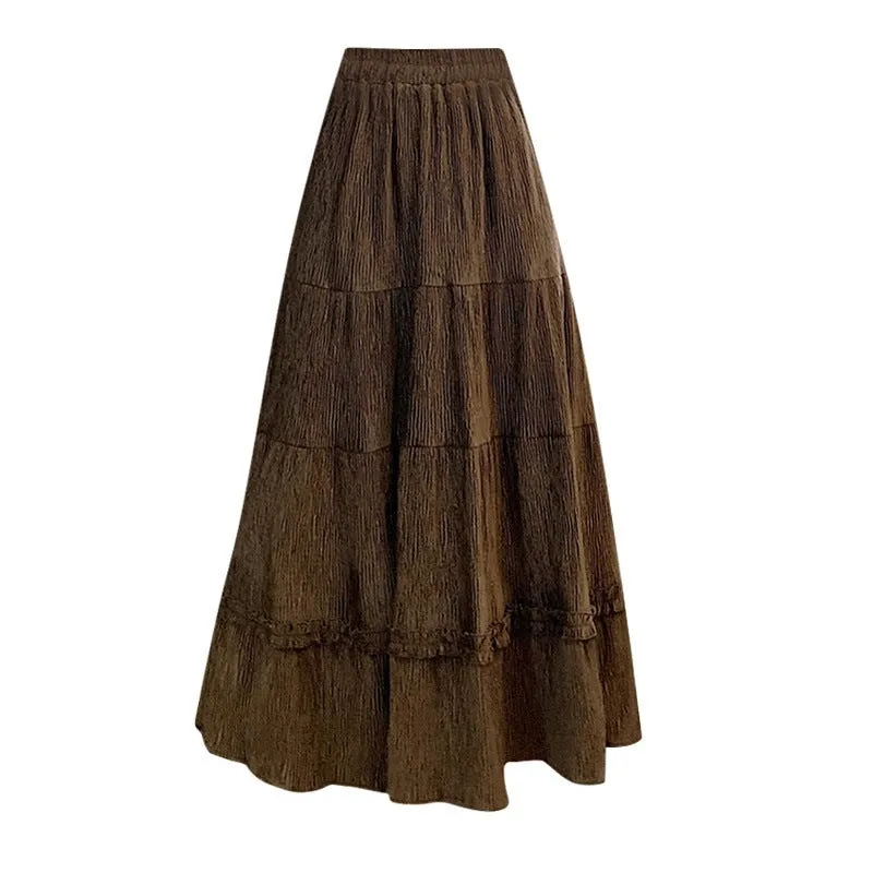 Beige corduroy A-line midi skirt with elastic waistband on a hanger.